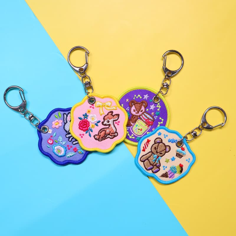 Customized fabric embroidered webbing tag key chain double-sided embroidery trendy pendant PU leather towel embroidered key chain 3