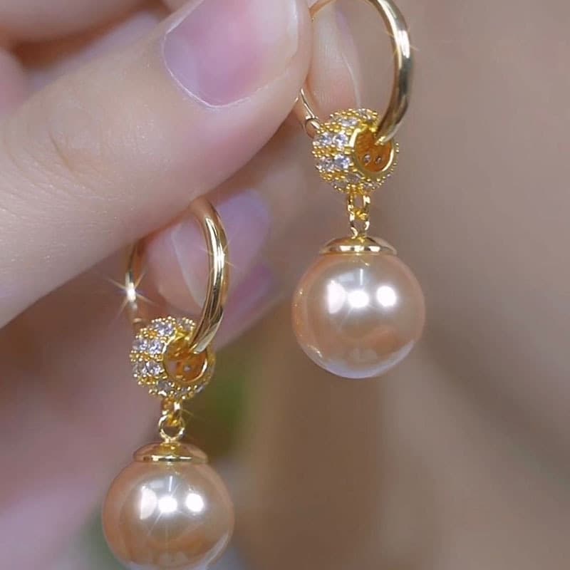 2024 autumn and winter new versatile champagne color pearl tassel earrings retro niche design internet celebrity hot style earrings 1