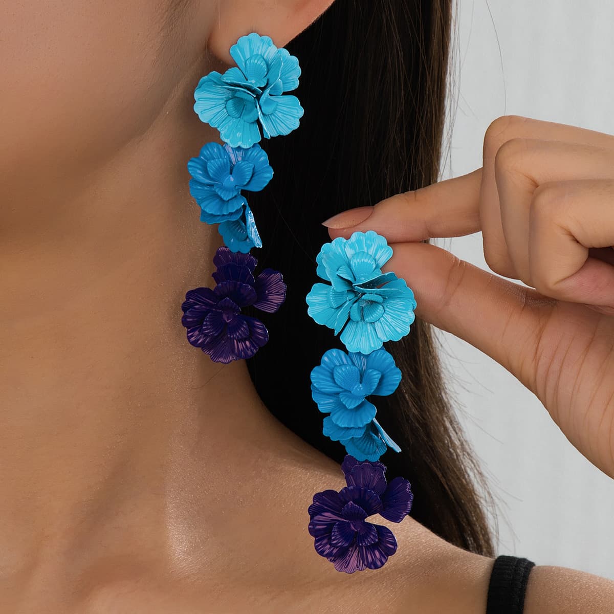 A pair of fashionable and elegant blue color-blocked long flower stud earrings for women, holiday wear gifts