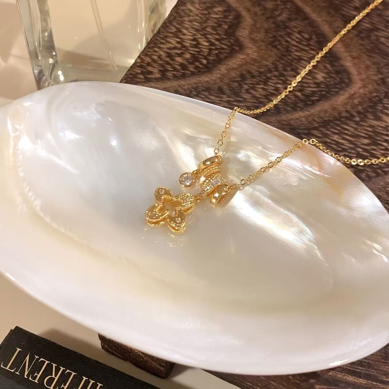 Gold shiny zirconium hollow four-leaf clover pendant necklace for women light luxury niche high-end sweater chain accessories long neck chain 4