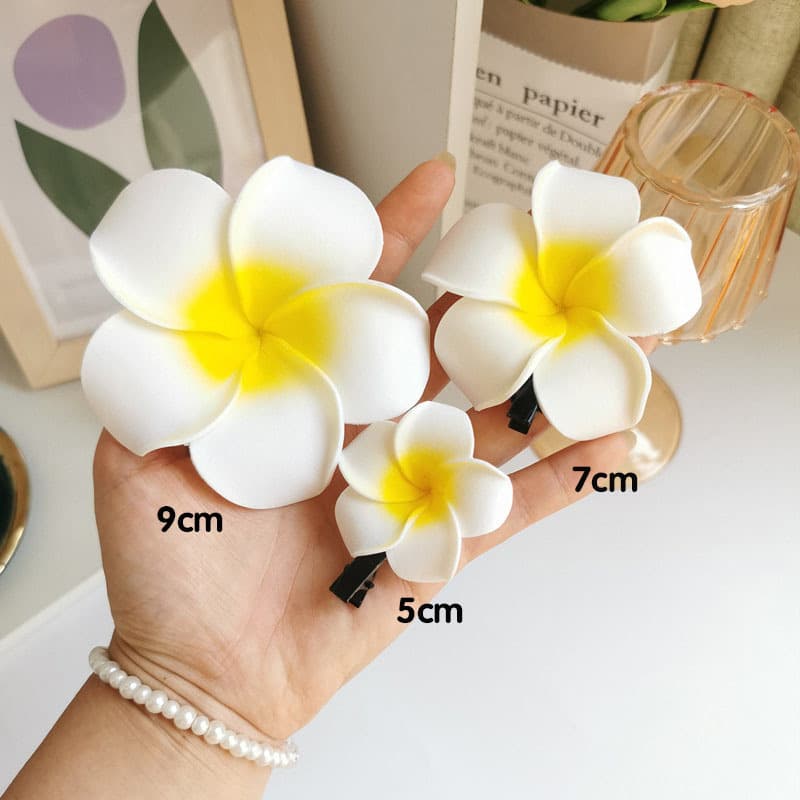 Beach and seaside frangipani hairpins. Wholesale of bridal tiaras and hair accessories for tourists and resorts. 5
